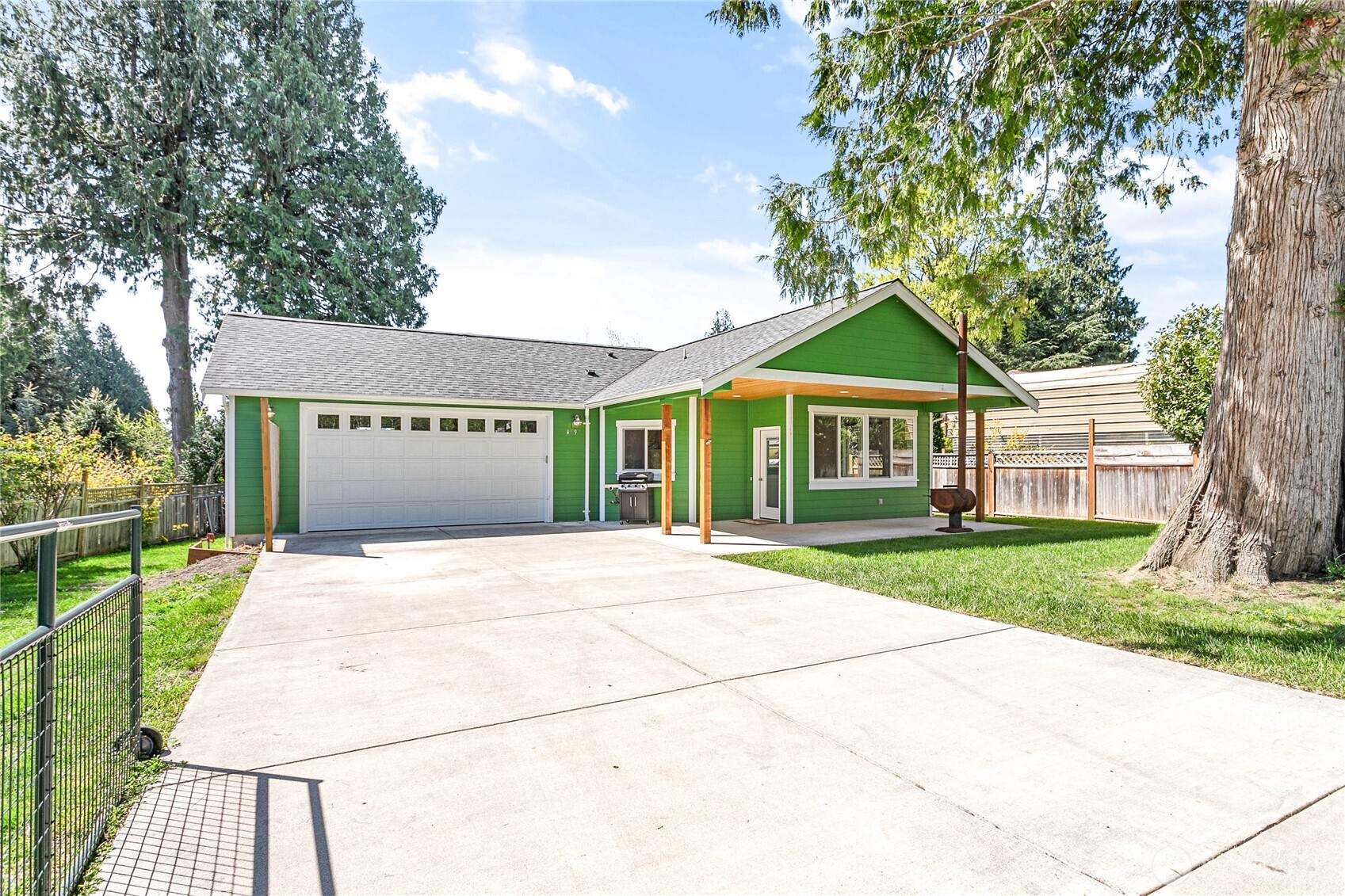 4597 Orcas Way Ferndale, WA 98248 - Photo 32 of 40 a front view of a house with a yard and garage