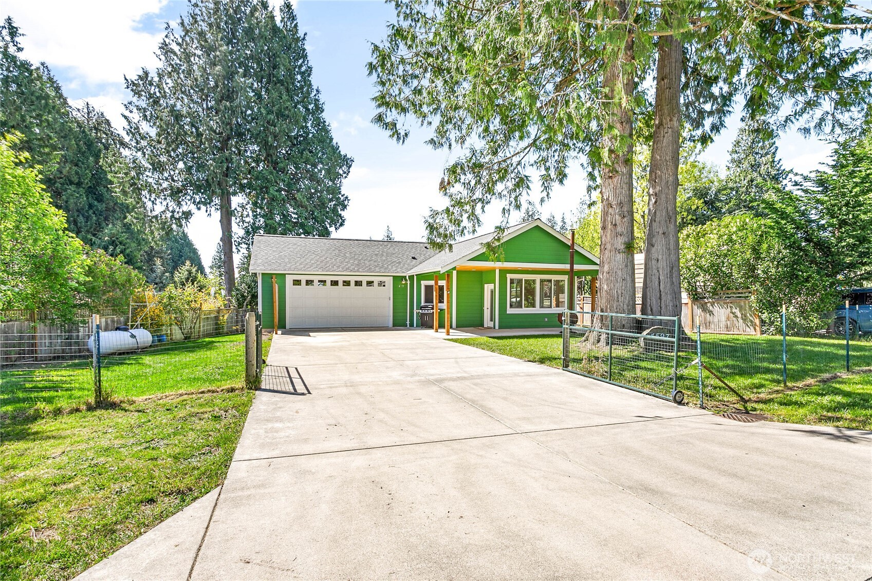 4597 Orcas Way Ferndale, WA 98248 - Photo 33 of 40 a view of front of house with a yard and potted plants