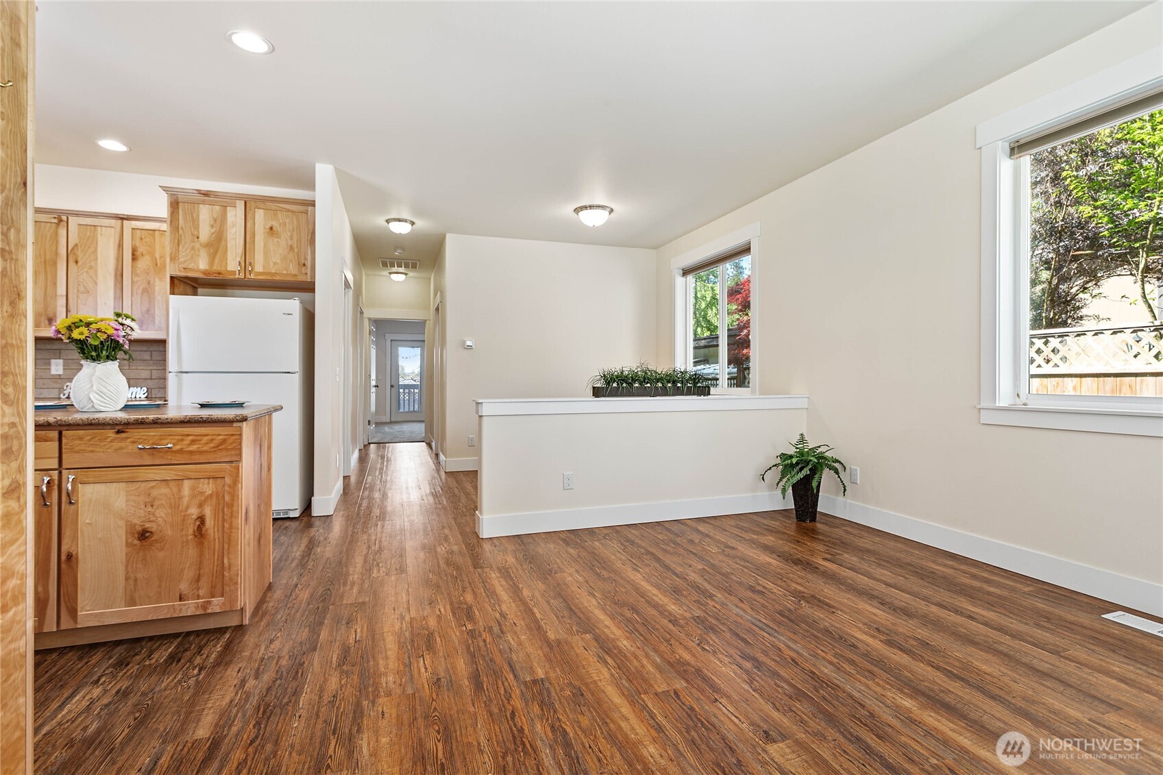4597 Orcas Way Ferndale, WA 98248 - Photo 4 of 40 a view of a kitchen with wooden floor and a window