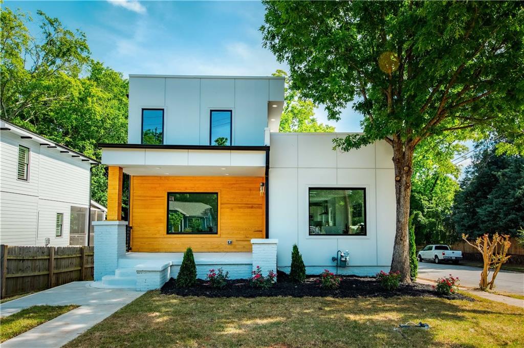 a front view of a house with garden