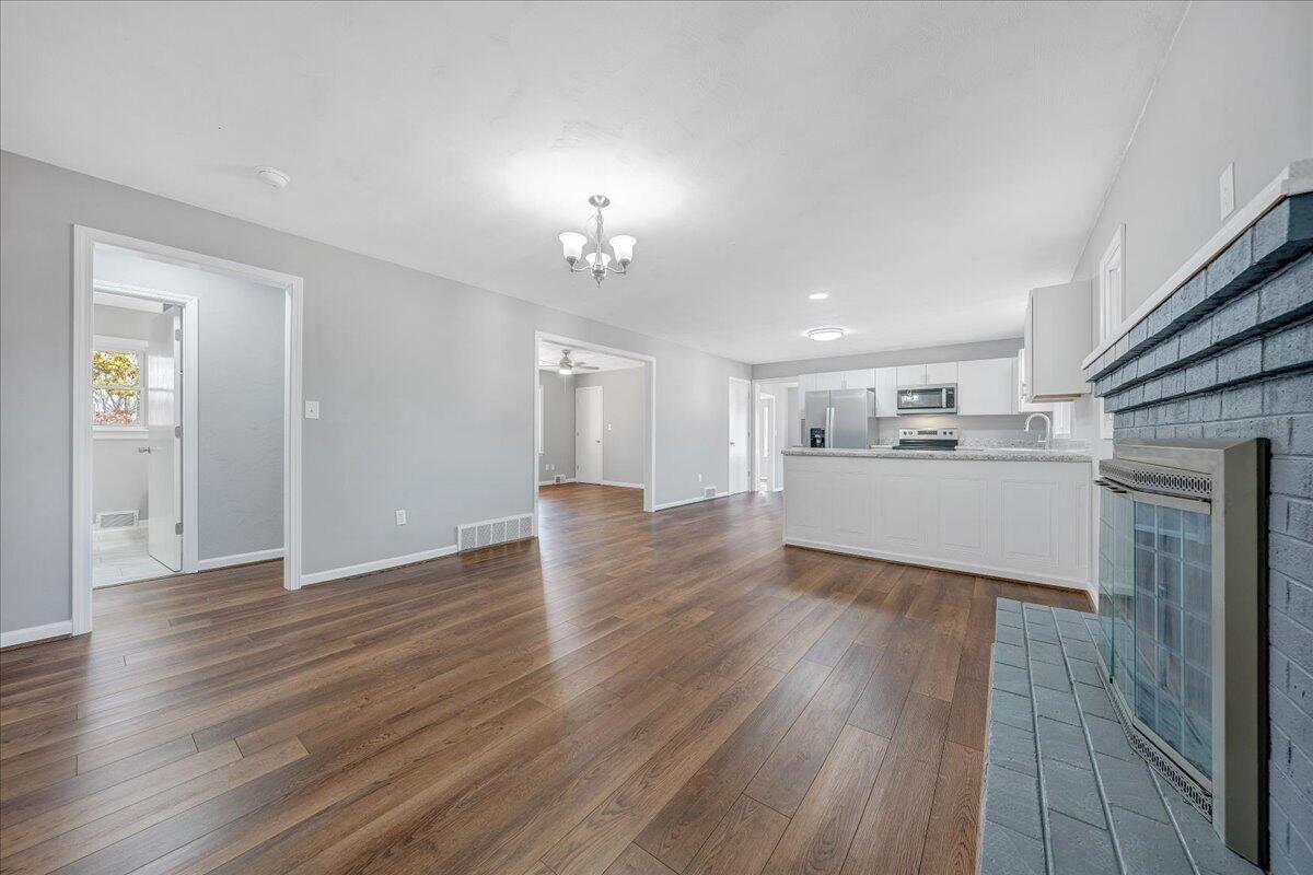 2353 Thompson Ridge Road Ferrum, VA 24088 - Photo 10 of 46 a view of a kitchen with furniture and wooden floor