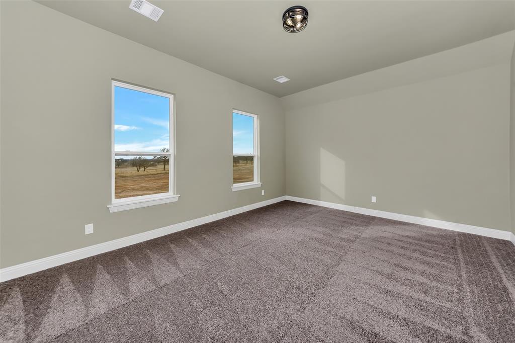 1057 Vh Ranch Poolville, TX 76487 - Photo 23 of 33 an empty room with windows