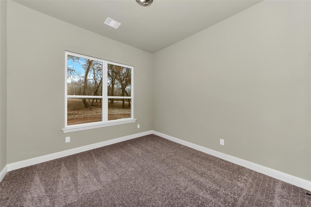 1057 Vh Ranch Poolville, TX 76487 - Photo 28 of 33 an empty room with window