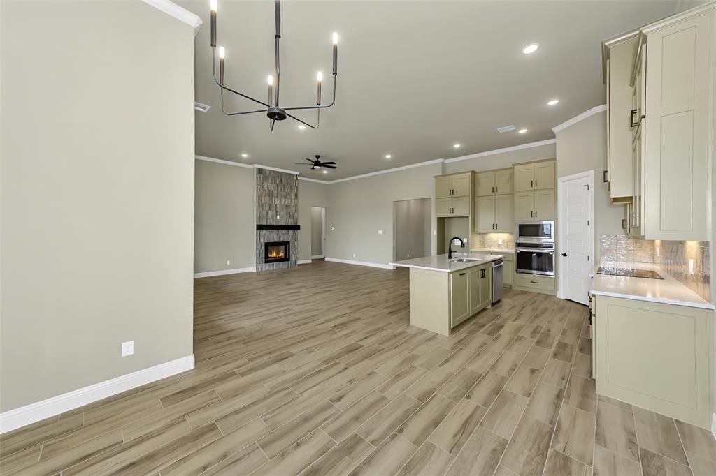 1057 Vh Ranch Poolville, TX 76487 - Photo 10 of 33 a open kitchen view with wooden floor and stainless steel appliances