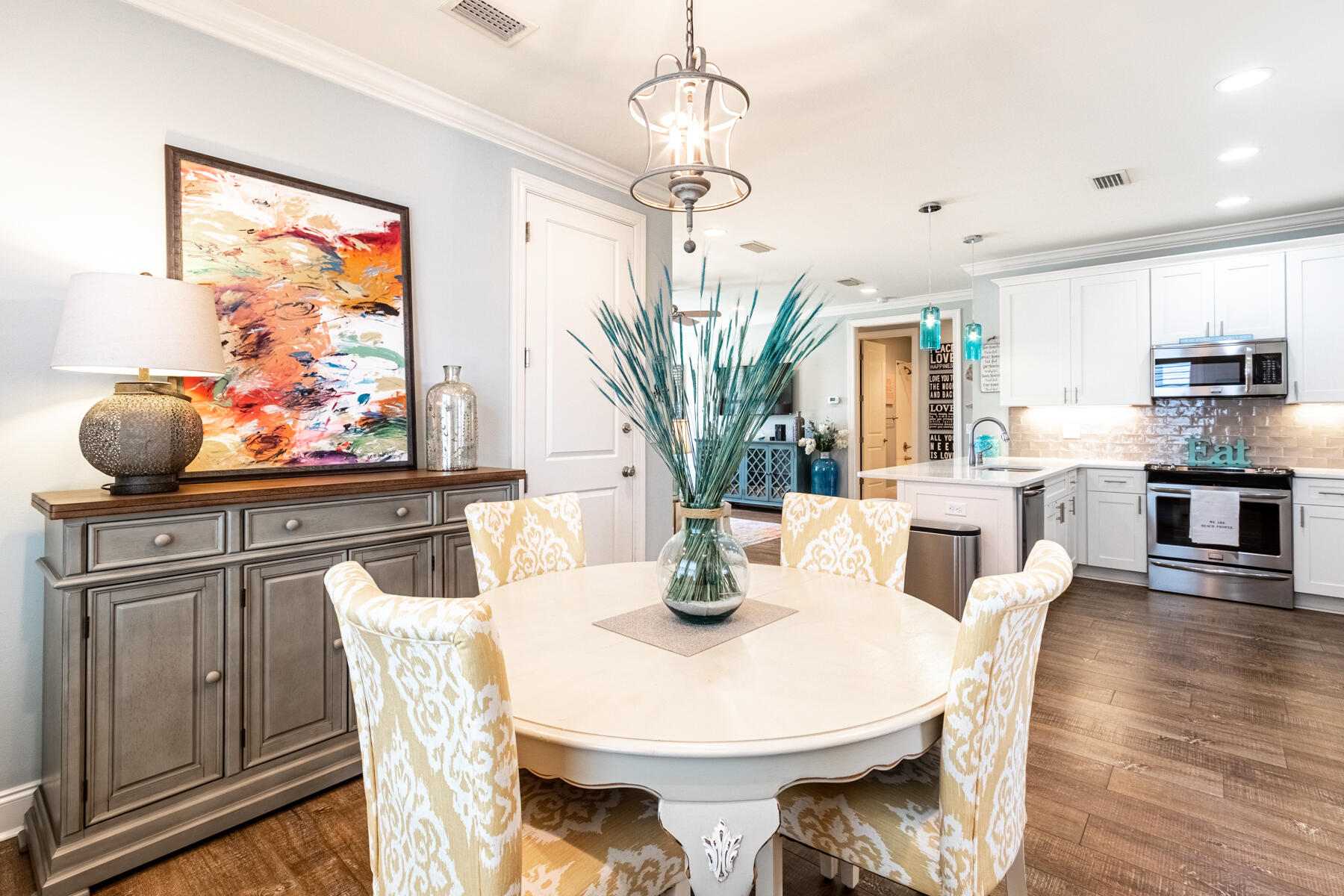 85 Chapman Street Santa Rosa Beach, FL 32459 - Photo 10 of 36 a view of a dining room with furniture wooden floor and chandelier