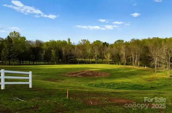 a view of a golf course with a lake