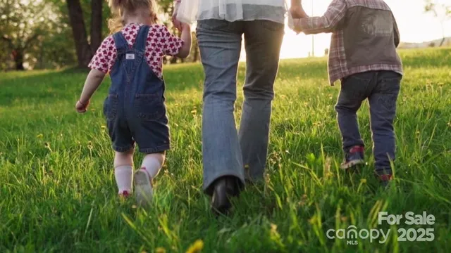 an aerial view of multi story residential apartment building with yard
