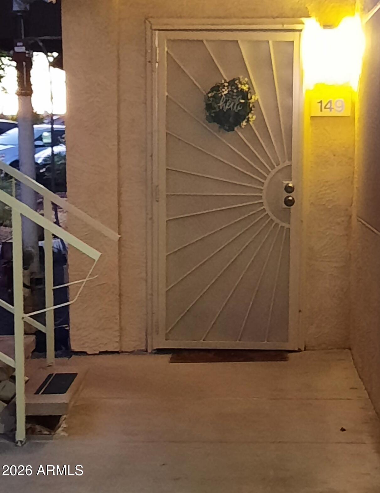 12221 West Bell Road, Unit 149 Surprise, AZ 85378 - Photo 1 of 28 a view of a door and wooden floor
