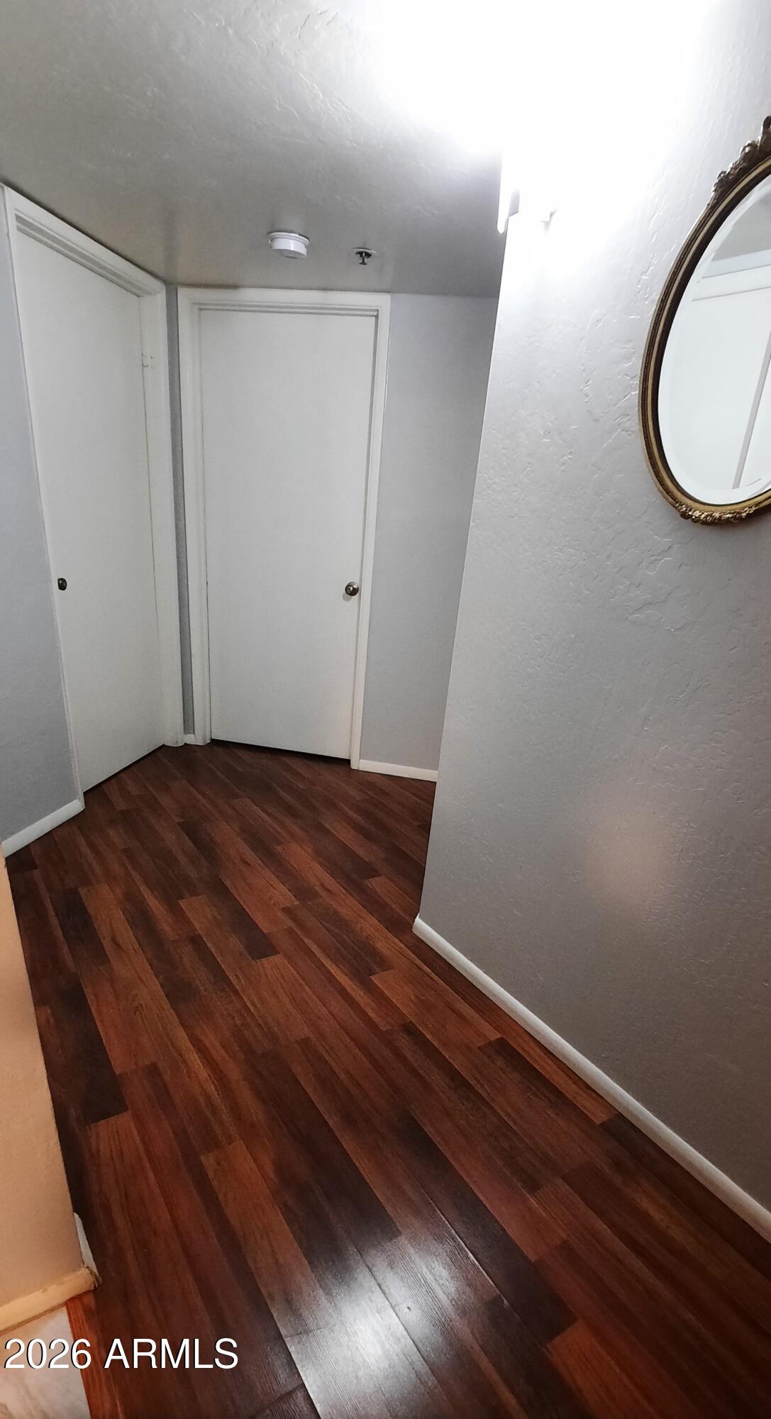 12221 West Bell Road, Unit 149 Surprise, AZ 85378 - Photo 11 of 28 a view of a room with wooden floor and window
