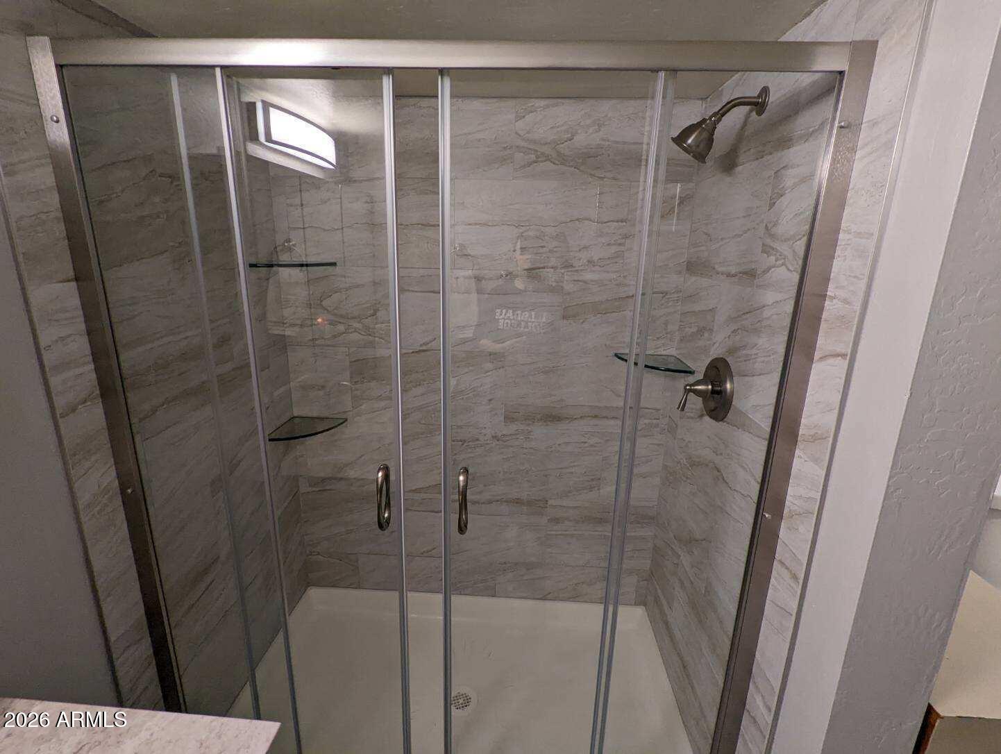 12221 West Bell Road, Unit 149 Surprise, AZ 85378 - Photo 20 of 28 a bathroom with a shower