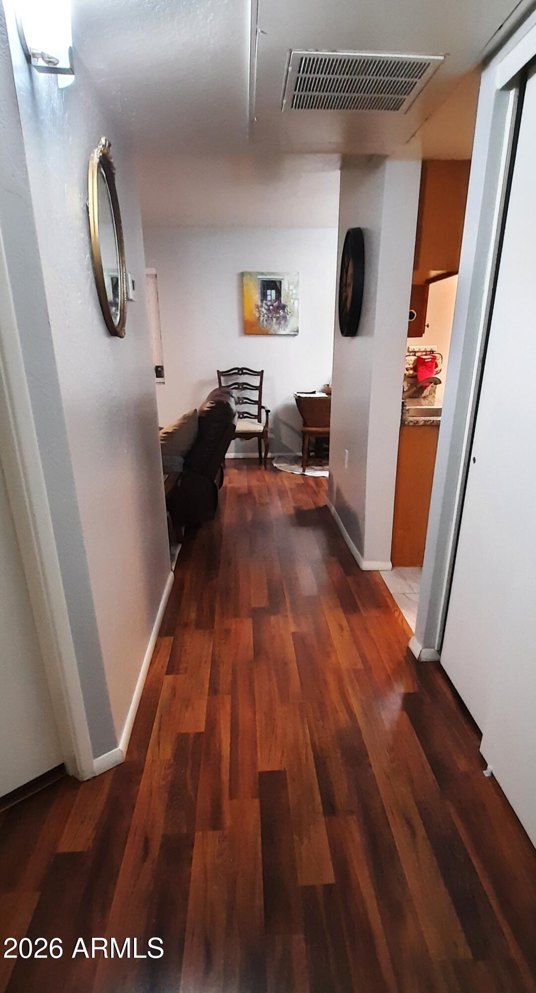 12221 West Bell Road, Unit 149 Surprise, AZ 85378 - Photo 21 of 28 a living room with furniture and a wooden floor