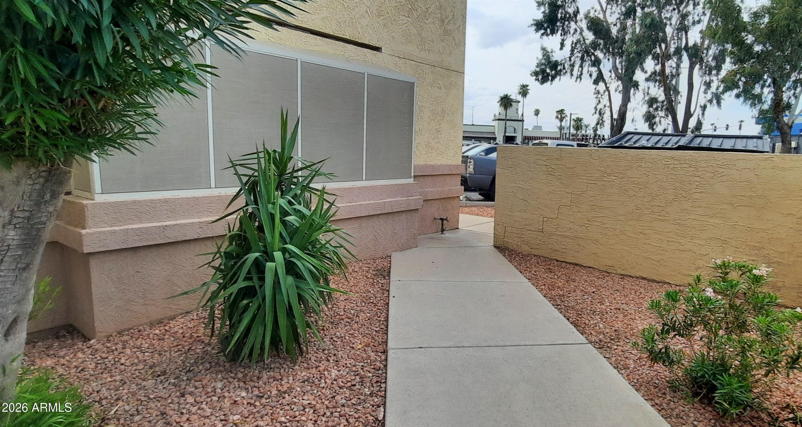 12221 West Bell Road, Unit 149 Surprise, AZ 85378 - Photo 23 of 28 a view of a backyard