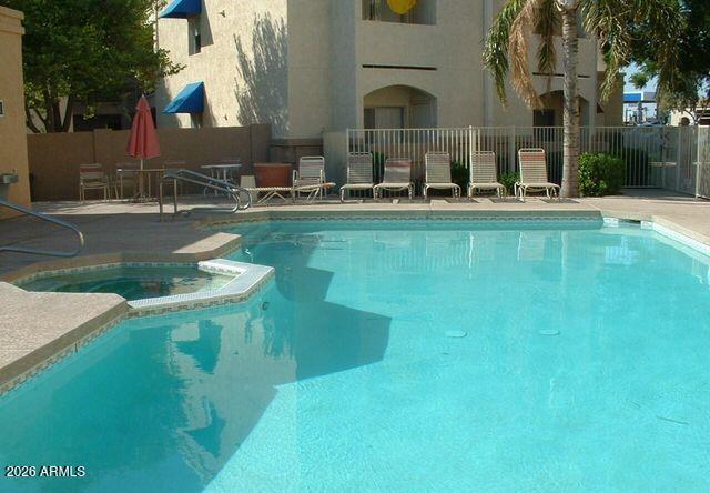 12221 West Bell Road, Unit 149 Surprise, AZ 85378 - Photo 25 of 28 a house view with swimming pool