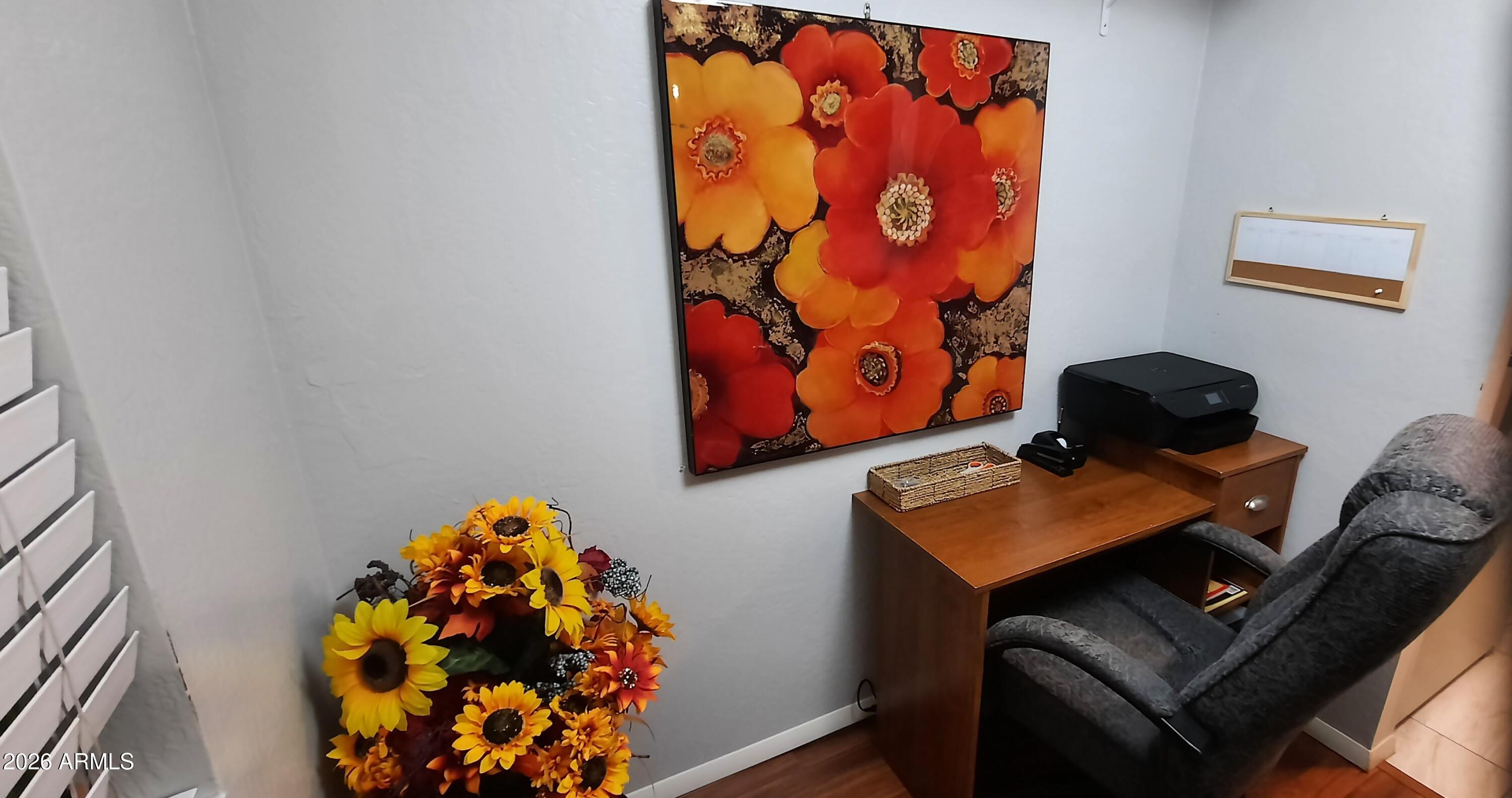 12221 West Bell Road, Unit 149 Surprise, AZ 85378 - Photo 4 of 28 a bedroom with a bed and a painting on the wall