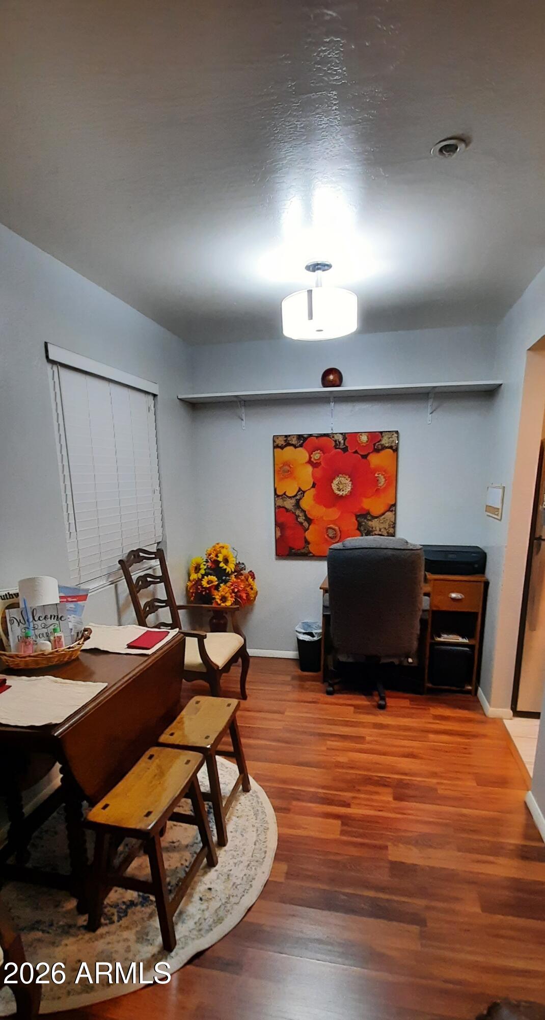 12221 West Bell Road, Unit 149 Surprise, AZ 85378 - Photo 5 of 28 a room with furniture projector and screen