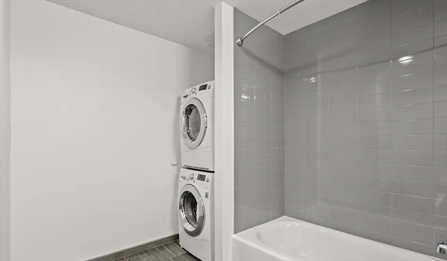 a bathroom with a sink a washer and dryer