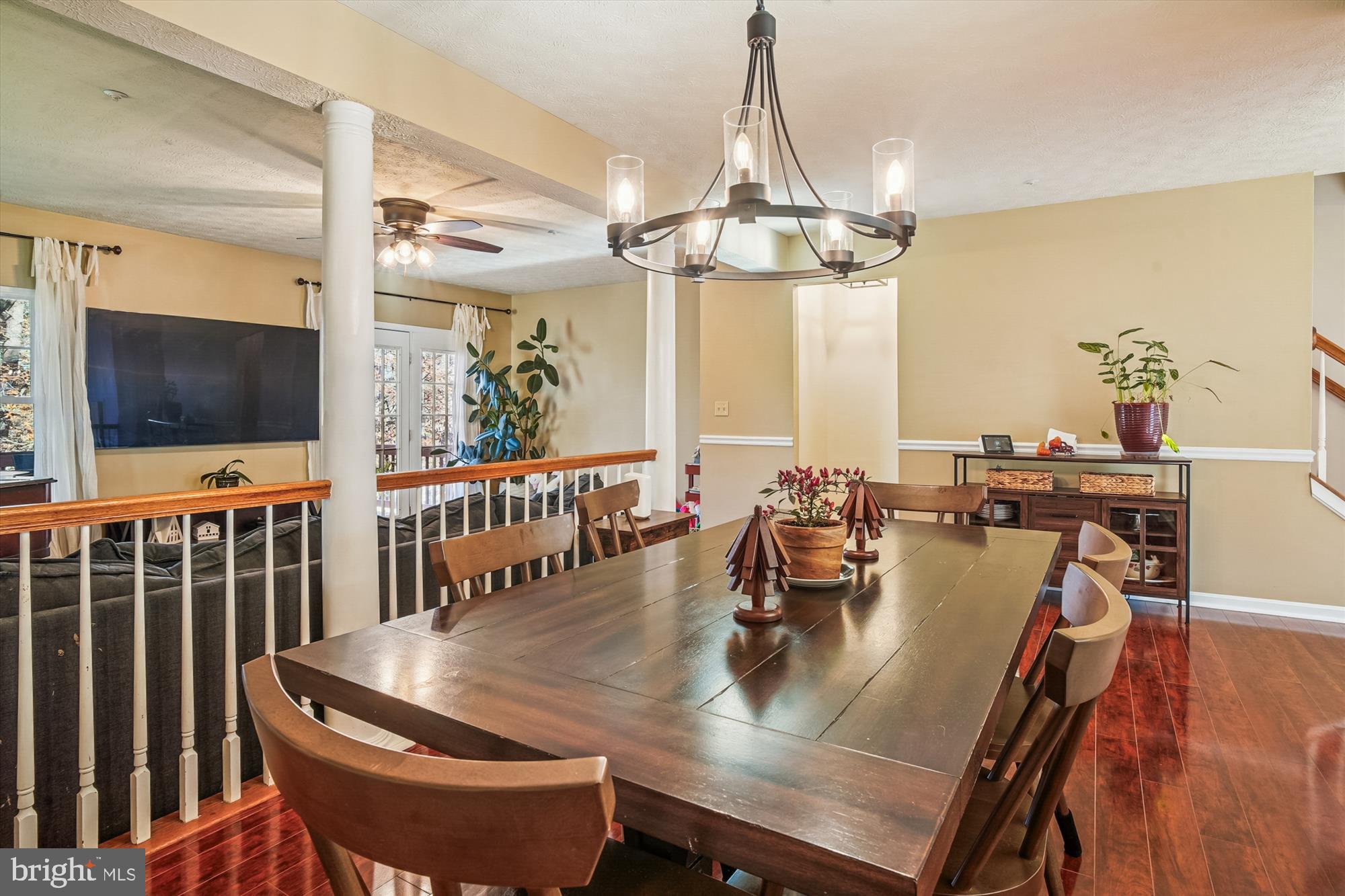2542 Windy Oak Court Crofton, MD 21114 - Photo 12 of 37 a dining room with furniture a chandelier and wooden floor