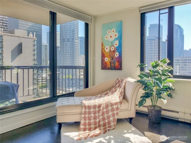 a living room with furniture and a potted plant