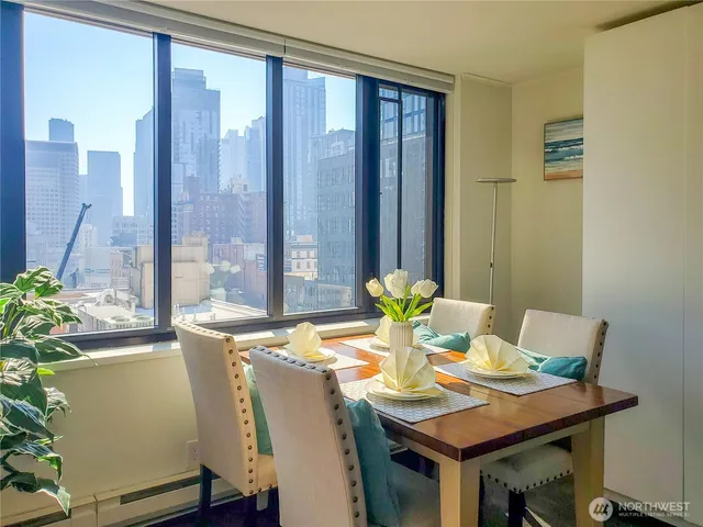 a view of a dining room with furniture and window