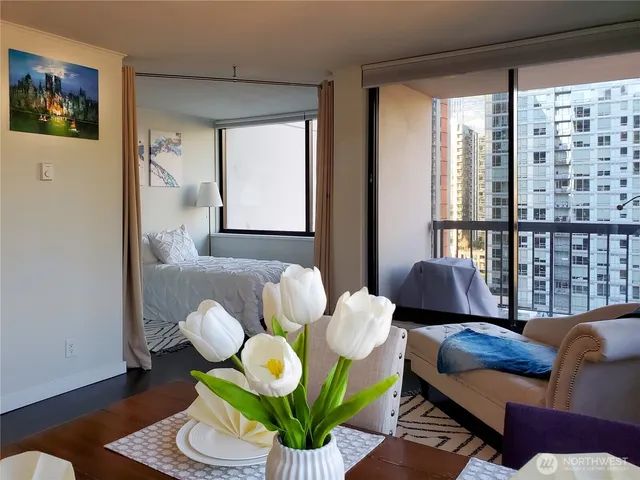 a living room with furniture and a large window