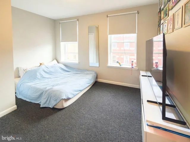a bathroom with a shower sink and mirror
