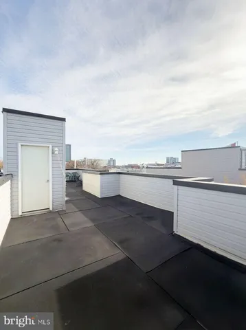 a kitchen with stainless steel appliances granite countertop a stove a refrigerator and a microwave