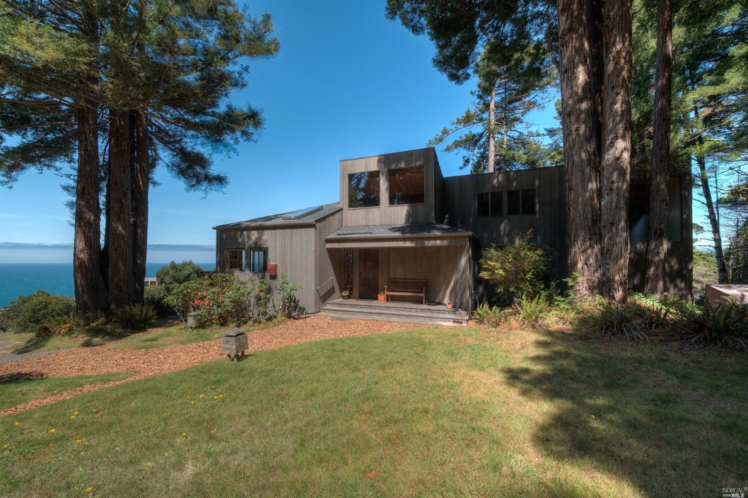 125 Larkspur Close The Sea Ranch, CA 95497 - Photo 1 of 1 a front view of a house with garden