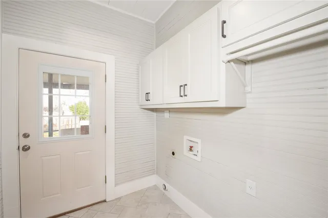 a view of kitchen with white cabinets