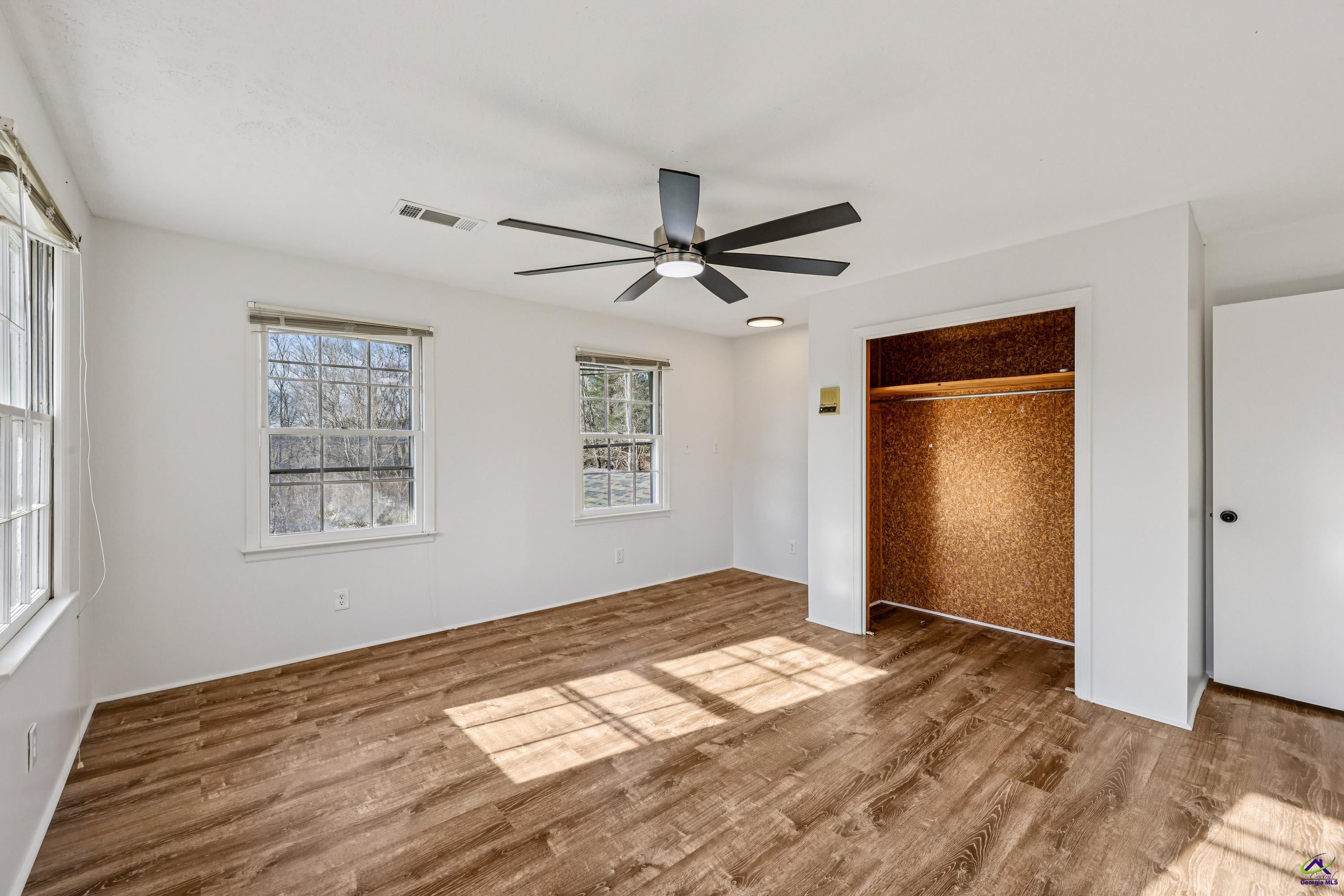 548 Greene Settlement Road Gray, GA 31032 - Photo 31 of 68 a view of empty room with wooden floor and fan