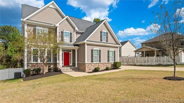 a front view of a house with a yard