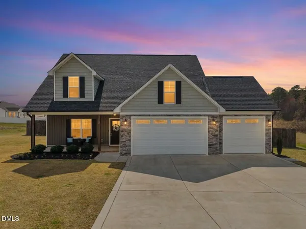 a front view of a house with yard