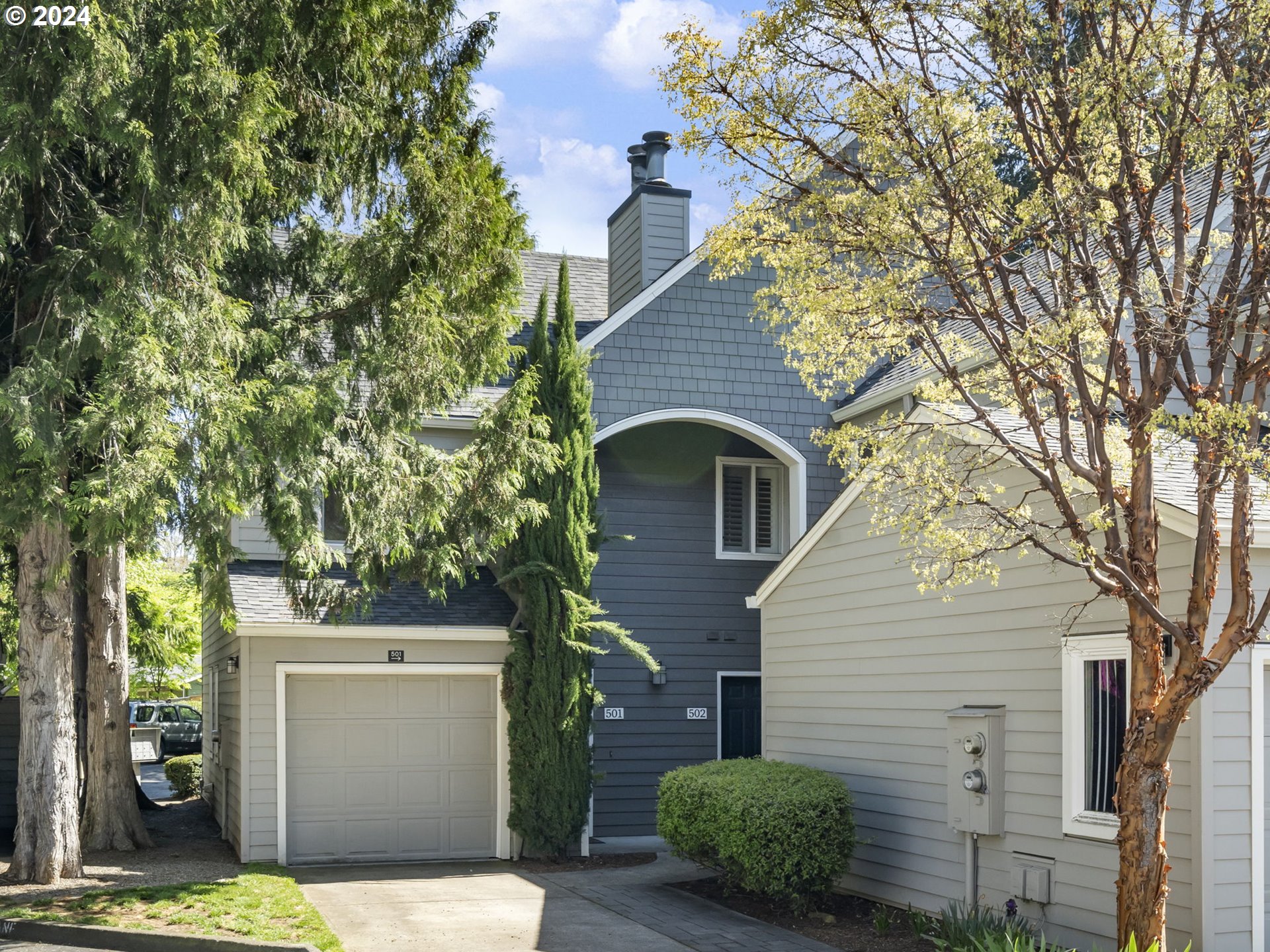 5225 Jean Road, Unit 501 Lake Oswego, OR 97035 - Photo 1 of 38 a front view of a house with garden