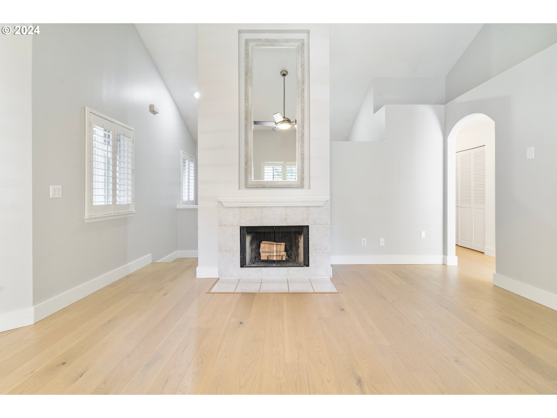 5225 Jean Road, Unit 501 Lake Oswego, OR 97035 - Photo 11 of 38 a view of an empty room with wooden floor and a window