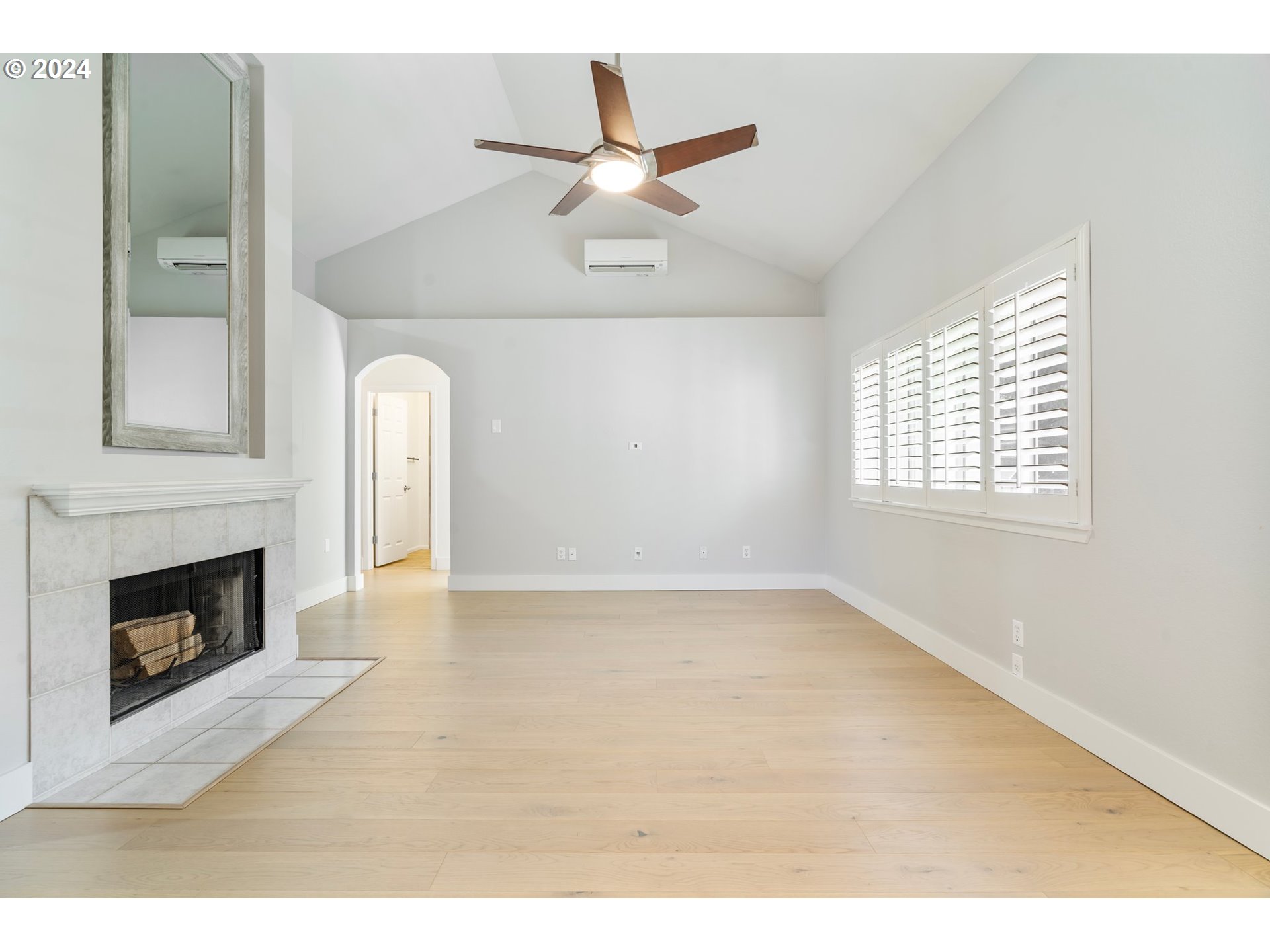 5225 Jean Road, Unit 501 Lake Oswego, OR 97035 - Photo 13 of 38 a view of an empty room with a fireplace and a window