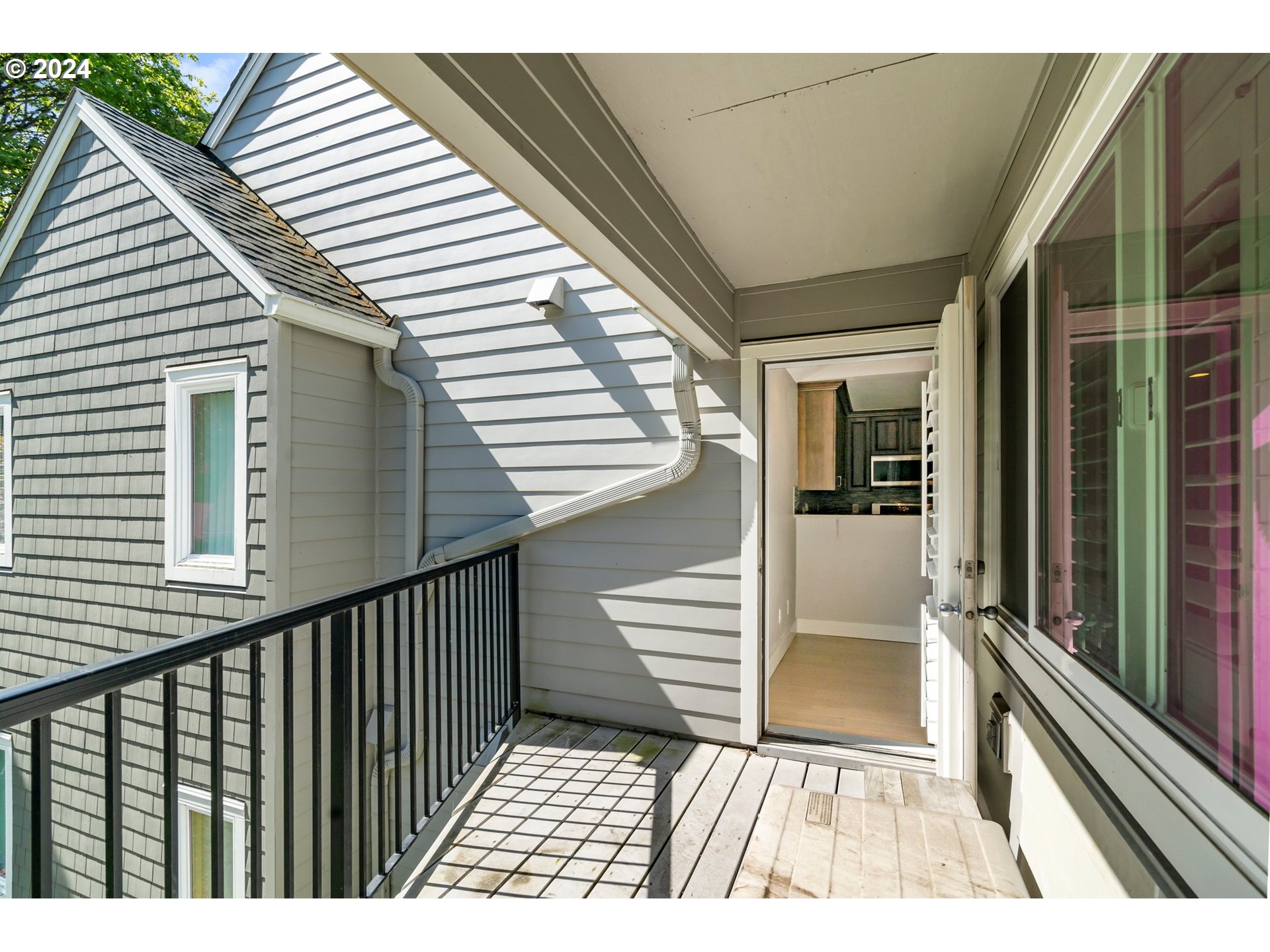 5225 Jean Road, Unit 501 Lake Oswego, OR 97035 - Photo 32 of 38 a view of a balcony with wooden floor and fence