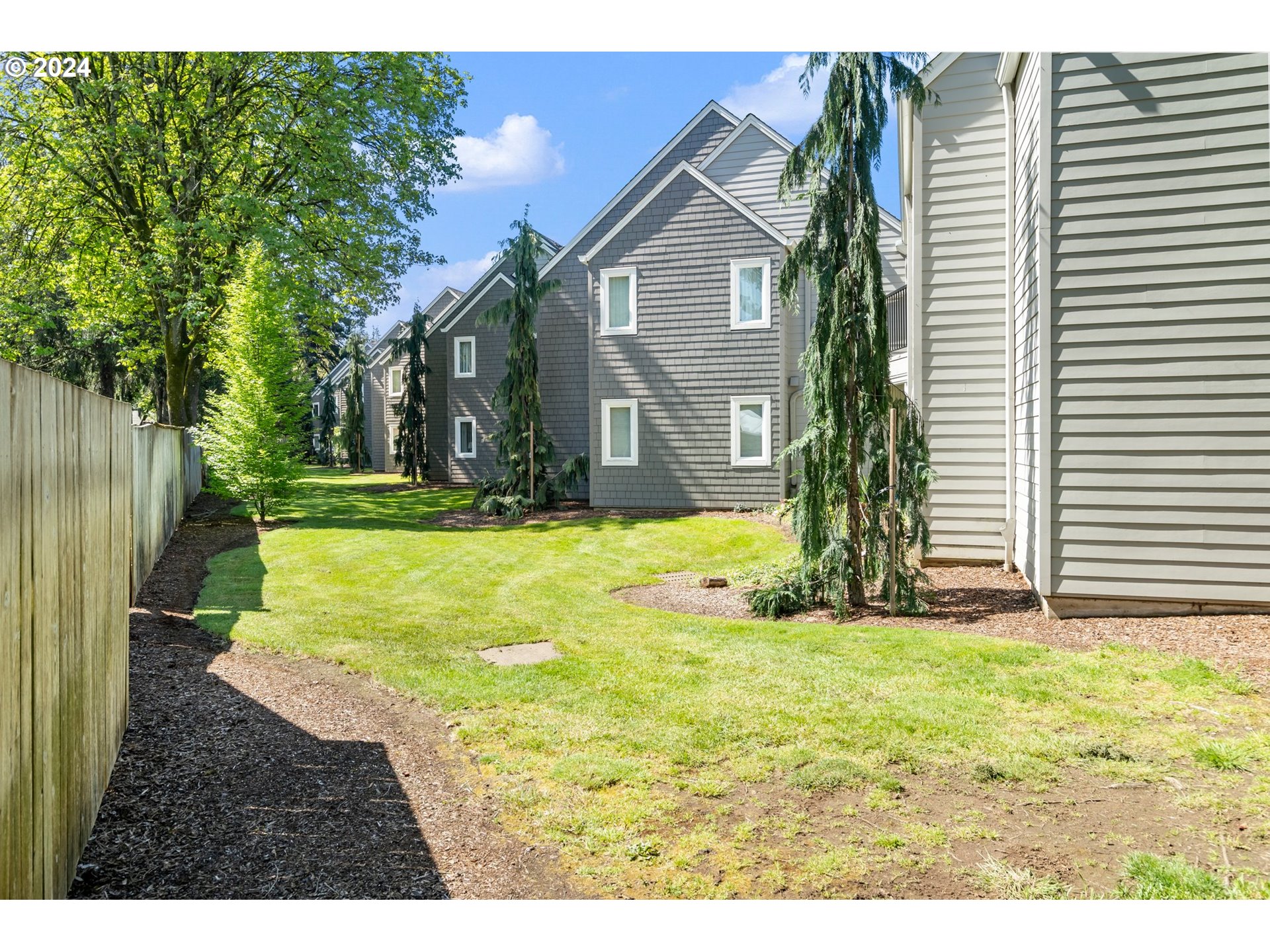 5225 Jean Road, Unit 501 Lake Oswego, OR 97035 - Photo 34 of 38 a view of a yard in front of a house with a large tree