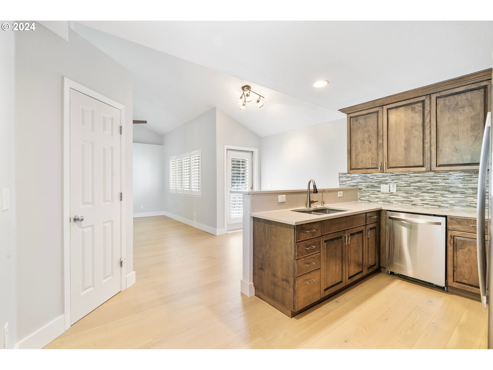 5225 Jean Road, Unit 501 Lake Oswego, OR 97035 - Photo 7 of 38 a kitchen with stainless steel appliances granite countertop a stove a sink and a refrigerator