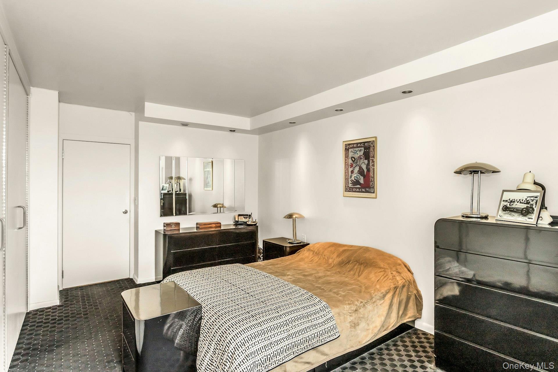 269 Grand Central Parkway, Unit 27T Queens, NY 11005 - Photo 12 of 43 a bedroom with a bed and wooden floor