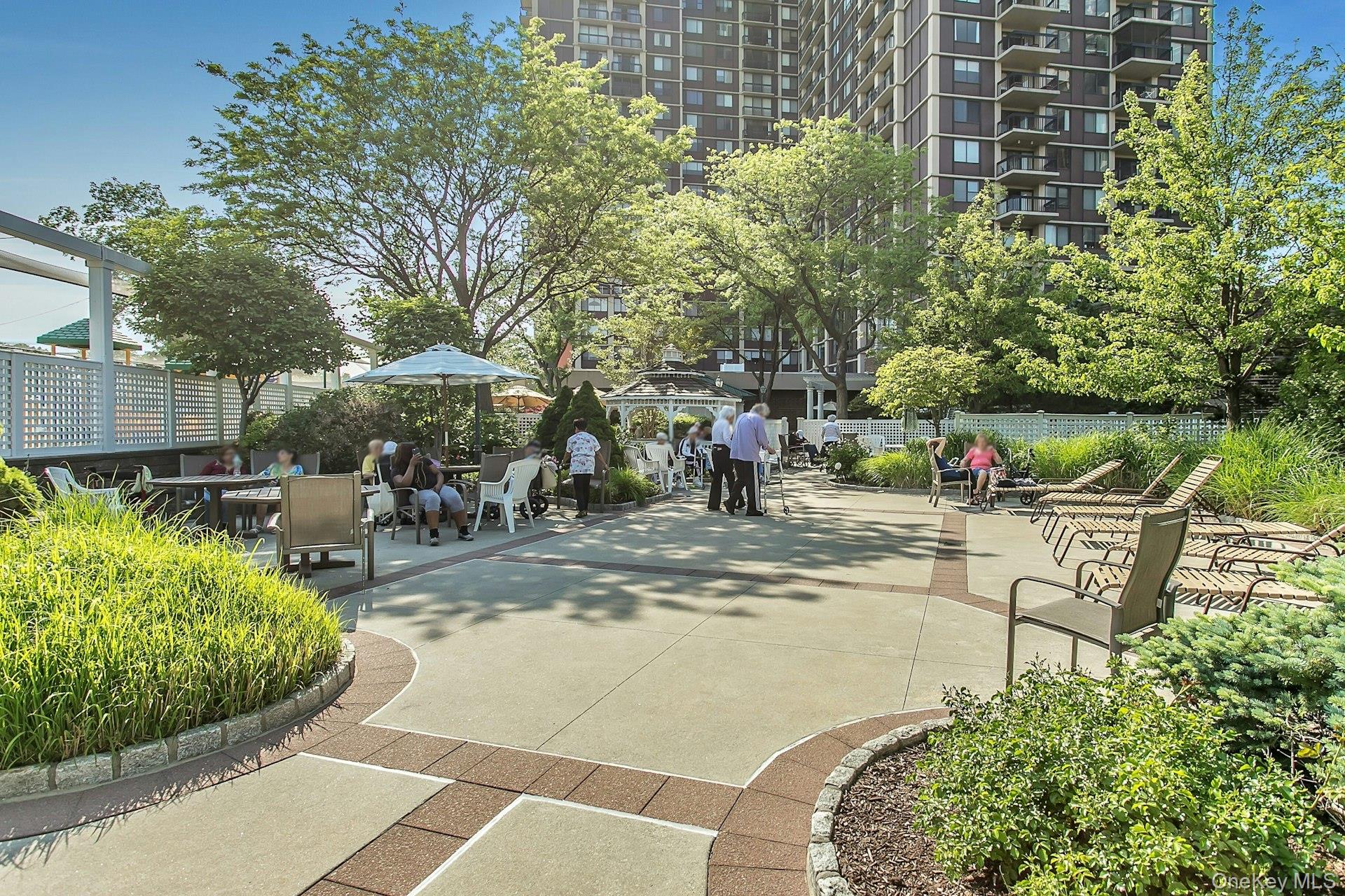 269 Grand Central Parkway, Unit 27T Queens, NY 11005 - Photo 24 of 43 a view of swimming pool with outdoor seating and plants