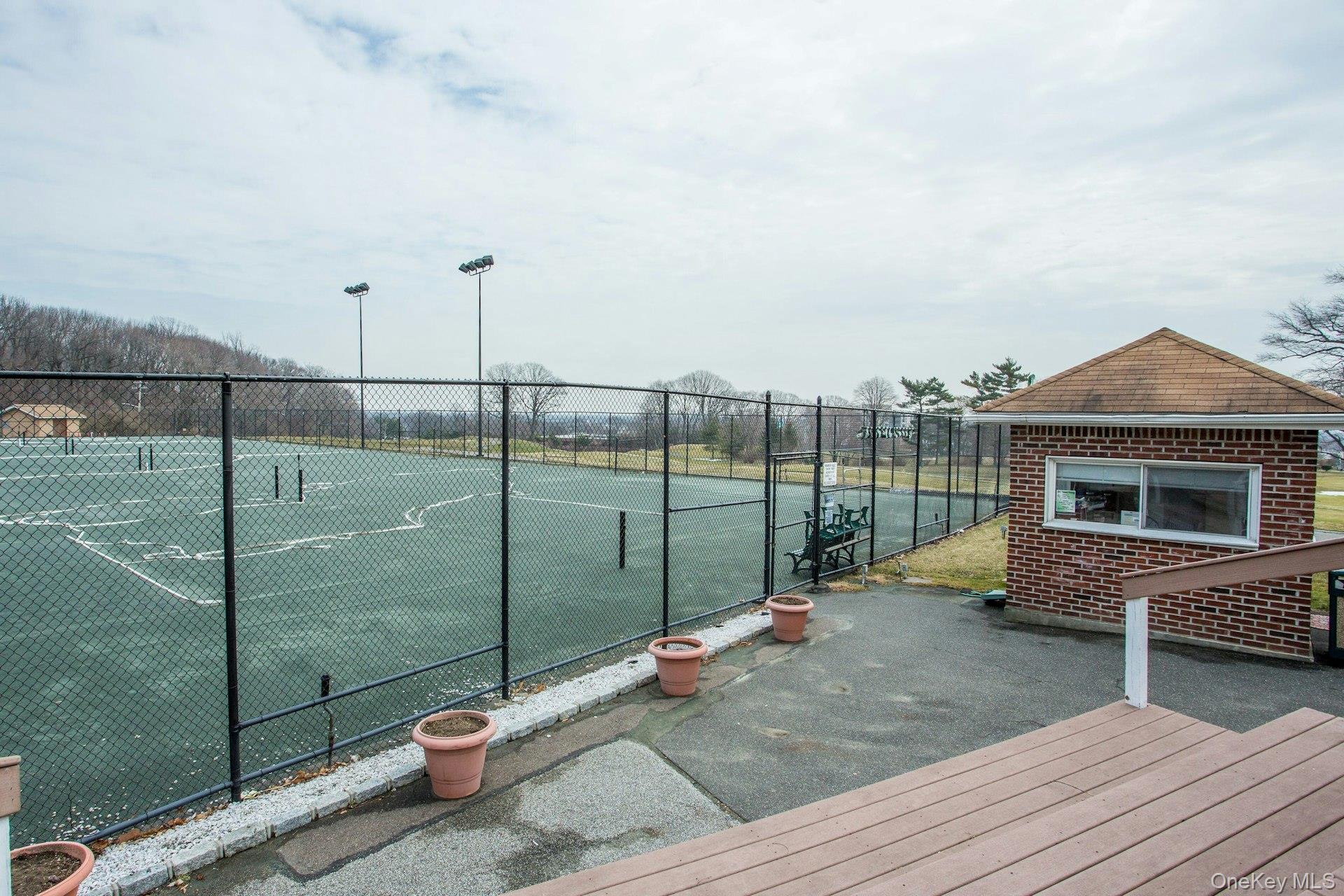 269 Grand Central Parkway, Unit 27T Queens, NY 11005 - Photo 41 of 43 a backyard of a house with fountain table and chairs