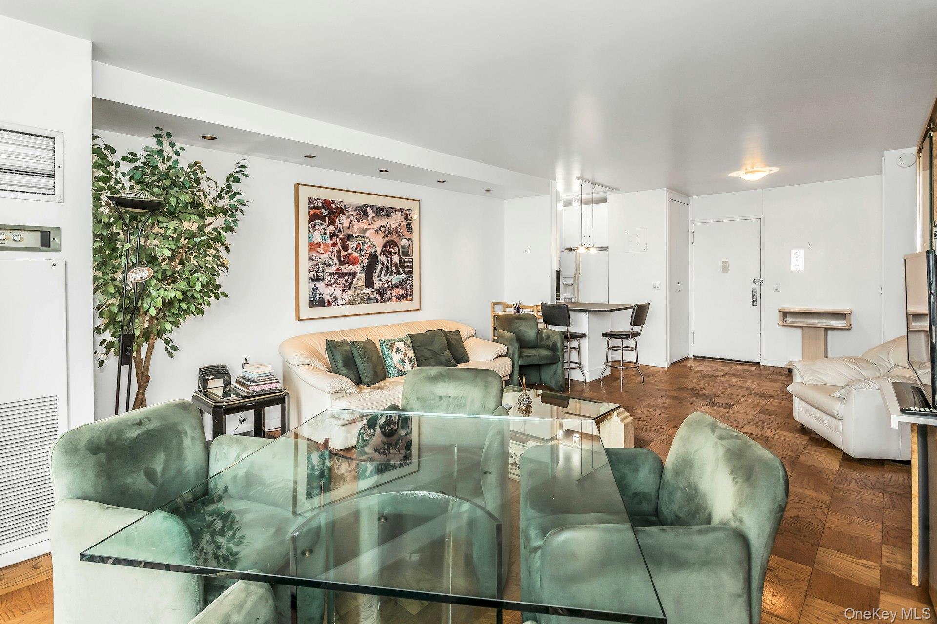 269 Grand Central Parkway, Unit 27T Queens, NY 11005 - Photo 8 of 43 a living room with furniture and a large window