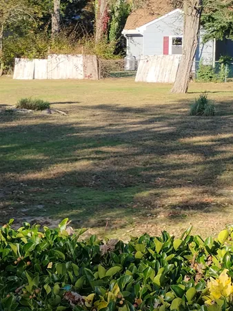 a view of a yard with an outdoor space