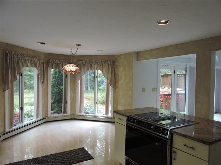 135 Pimlico Pond Road Mashpee, MA 02649 - Photo 12 of 35 a kitchen with a stove and a shower