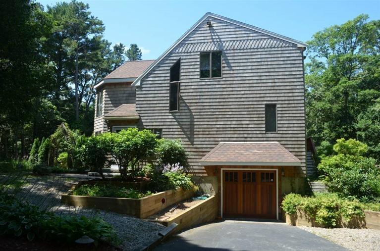 135 Pimlico Pond Road Mashpee, MA 02649 - Photo 3 of 35 a front view of a house with a yard
