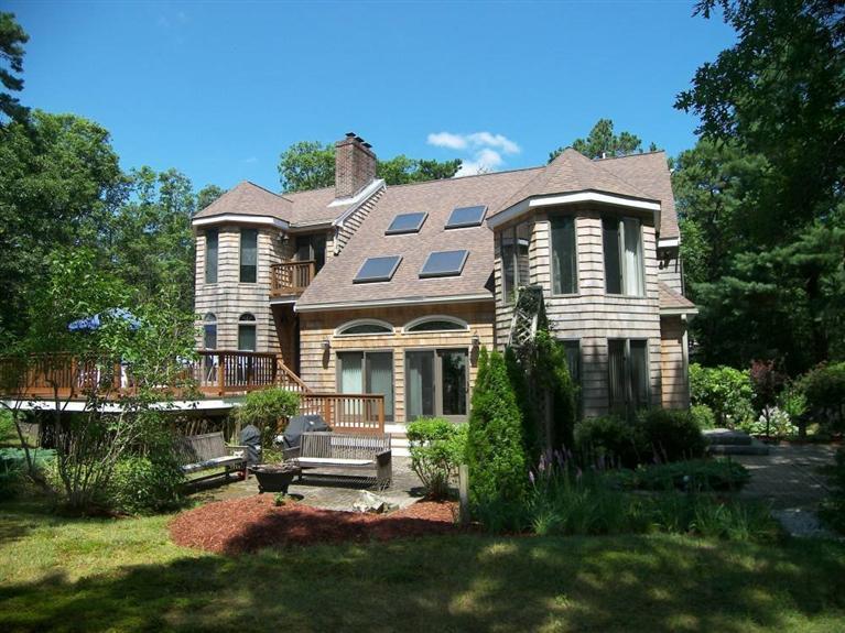 135 Pimlico Pond Road Mashpee, MA 02649 - Photo 31 of 35 a front view of a house with a yard