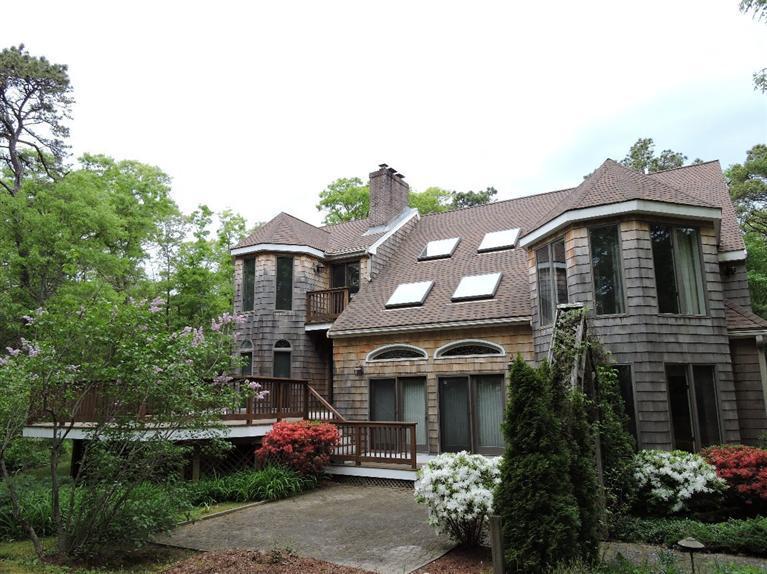 135 Pimlico Pond Road Mashpee, MA 02649 - Photo 4 of 35 a front view of a house