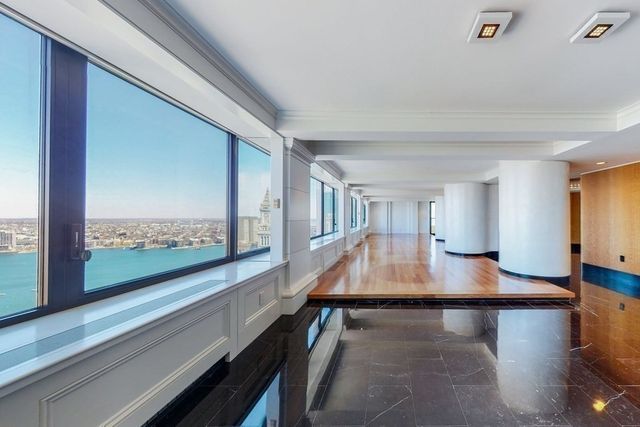 a view of a living room and floor with furniture