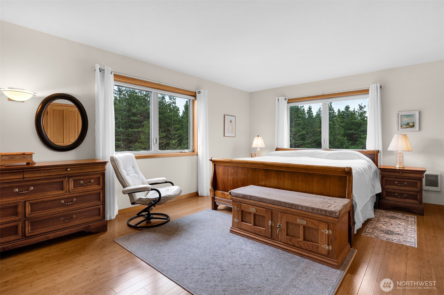 402 17th Street Southwest Long Beach, WA 98631 - Photo 12 of 32 a bedroom with a bed and a large window