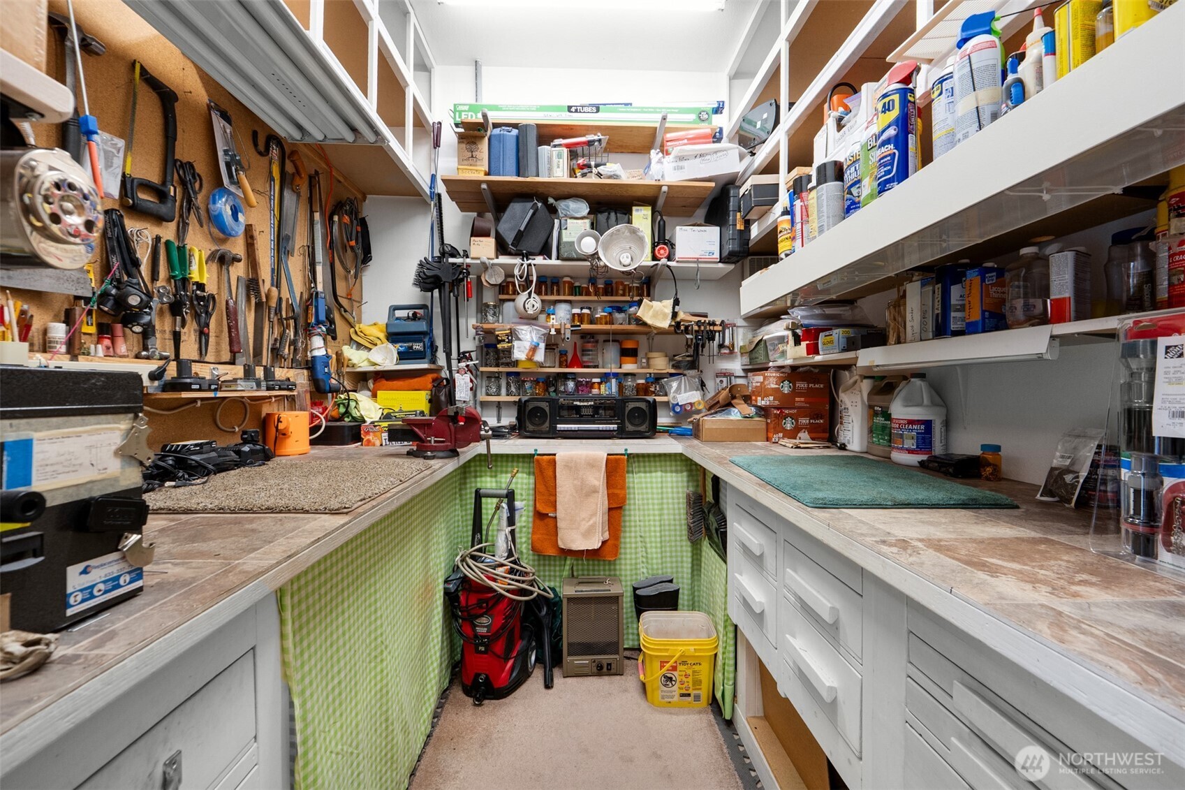 402 17th Street Southwest Long Beach, WA 98631 - Photo 24 of 32 a utility room with lots of clutter and cabinets