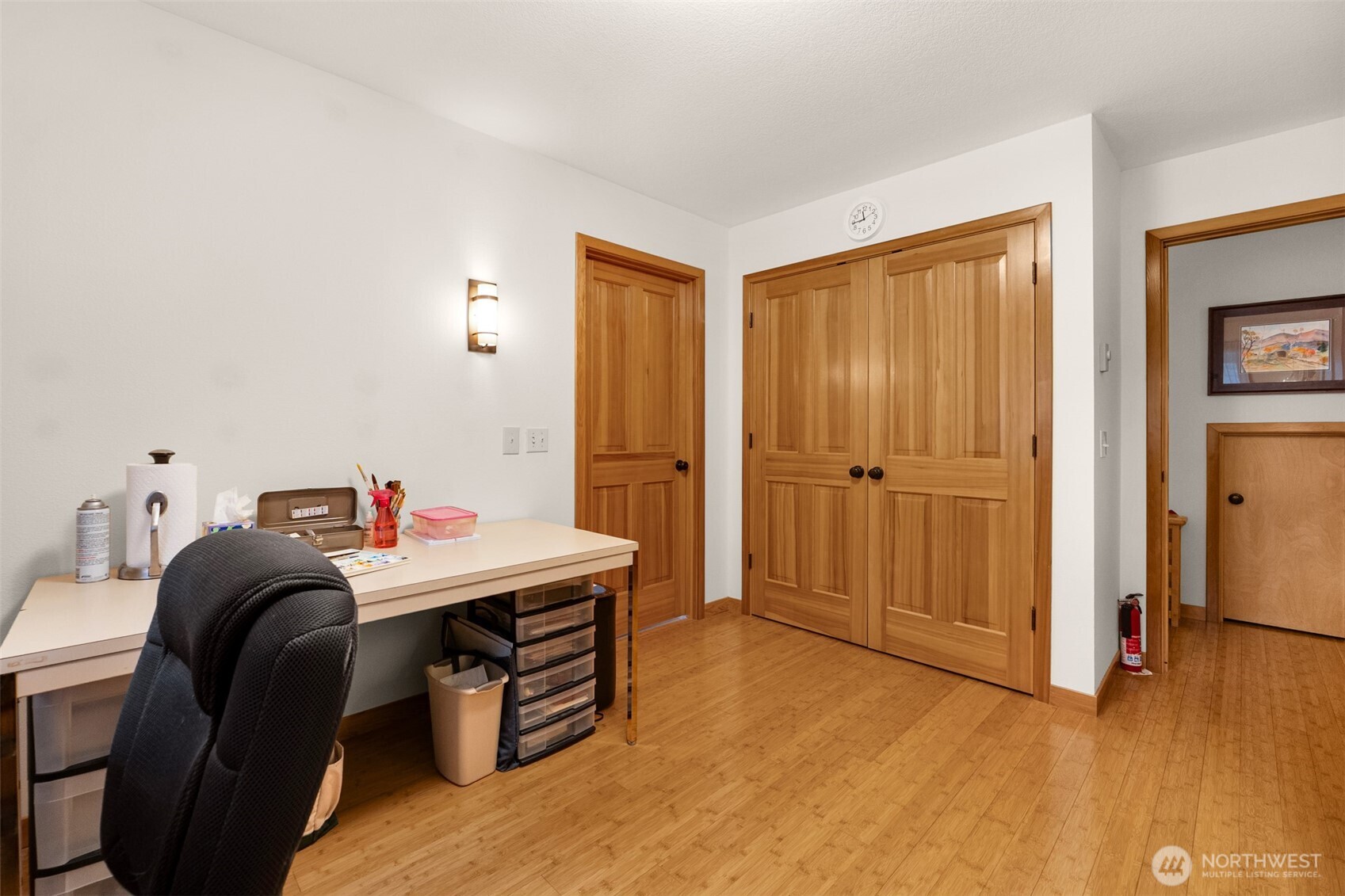 402 17th Street Southwest Long Beach, WA 98631 - Photo 27 of 32 a bedroom with a bed and a table